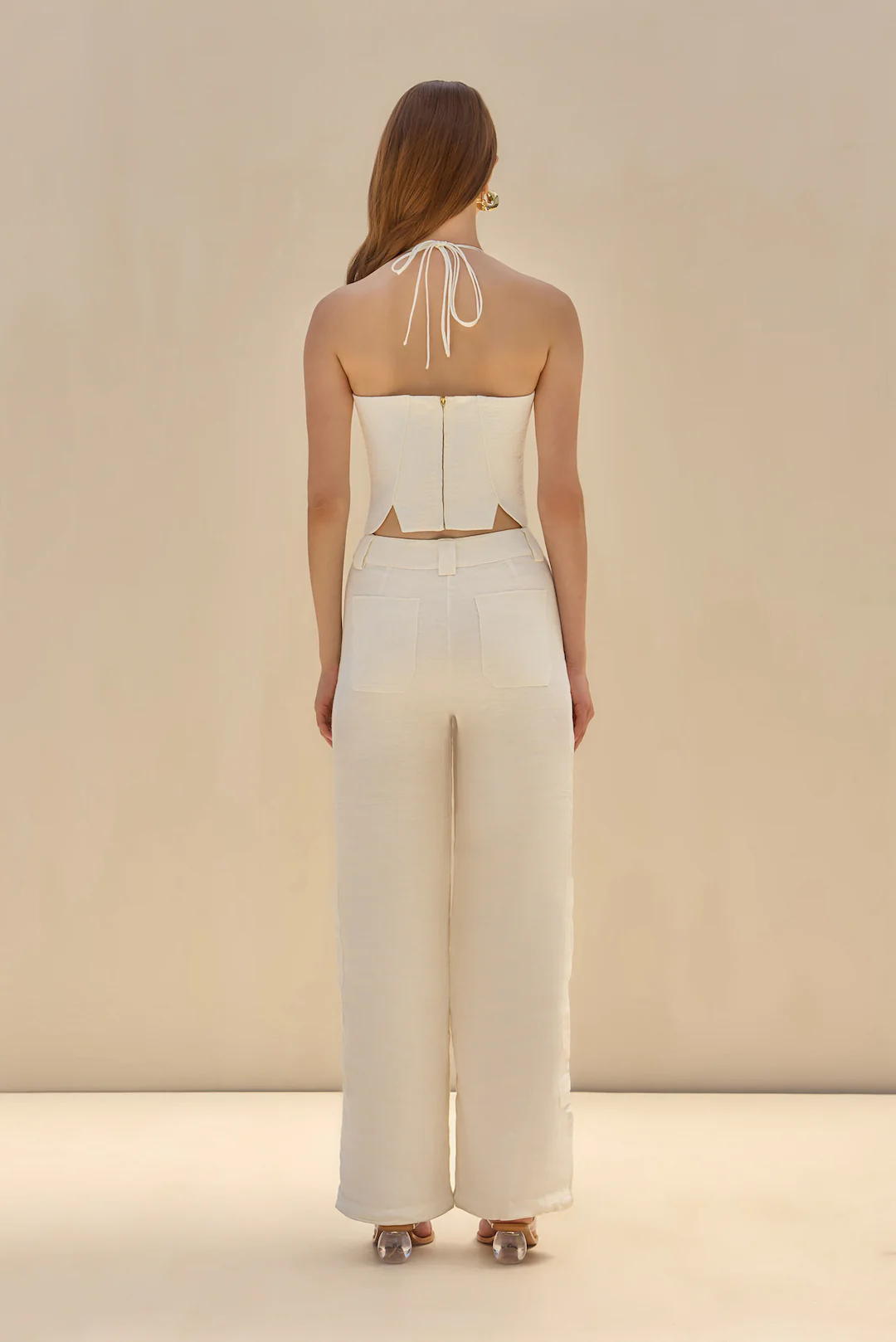 Ivory linen halter crop top with gathered cups and shaped bodice panels