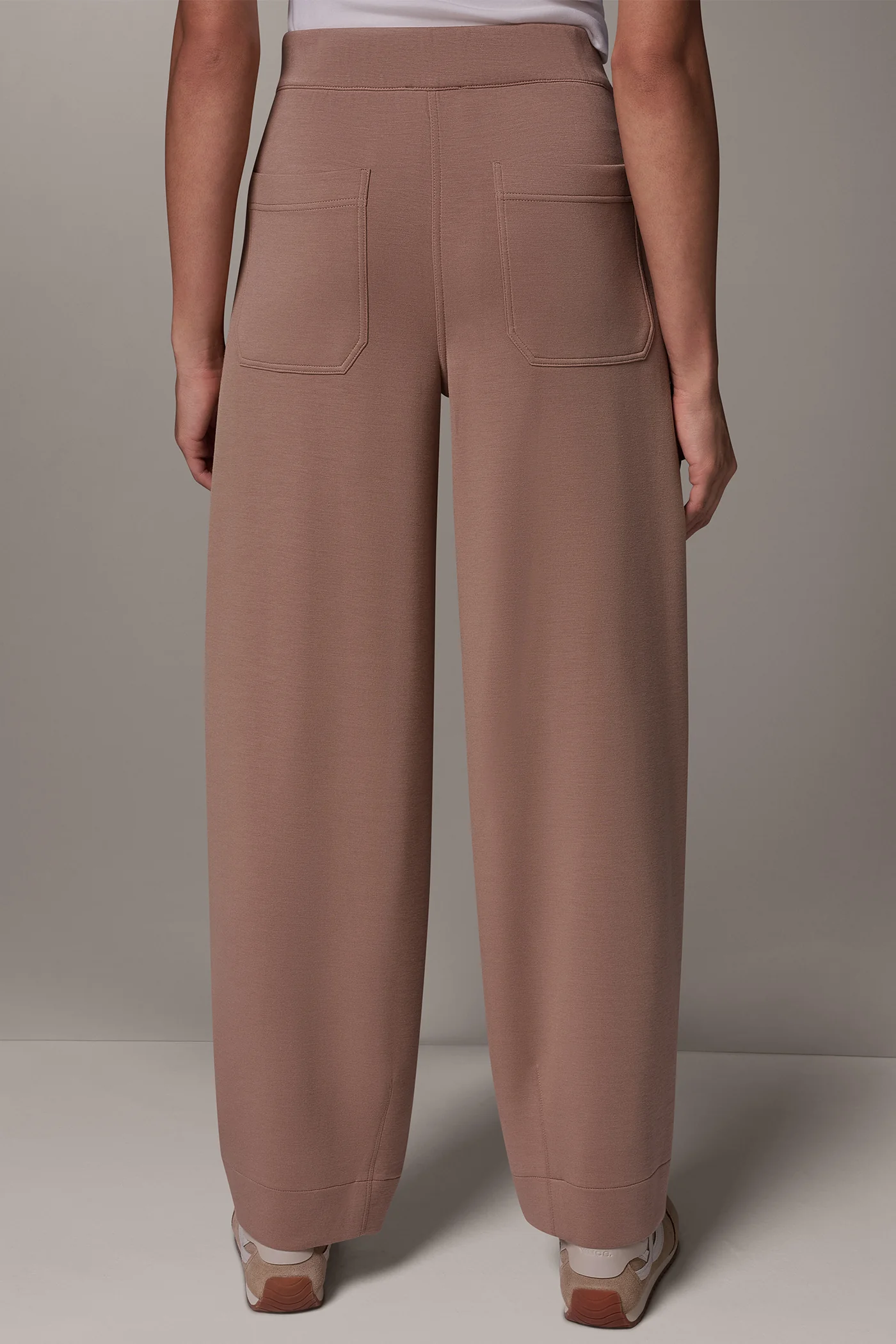 Dusty brown straight leg pants with zipped side pockets and back patch pockets