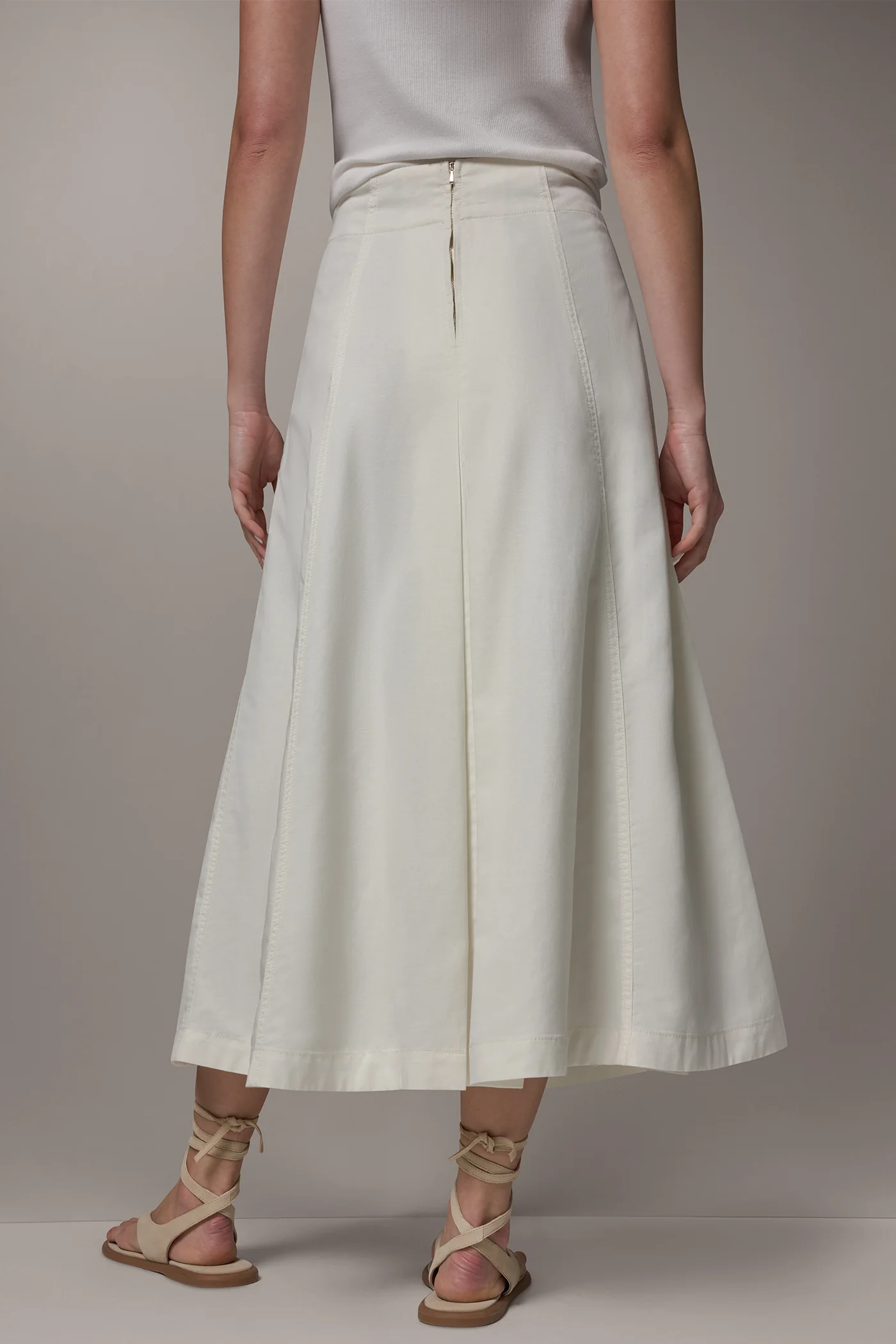 Off-white panelled A-line midi skirt with side pockets and a back zipper