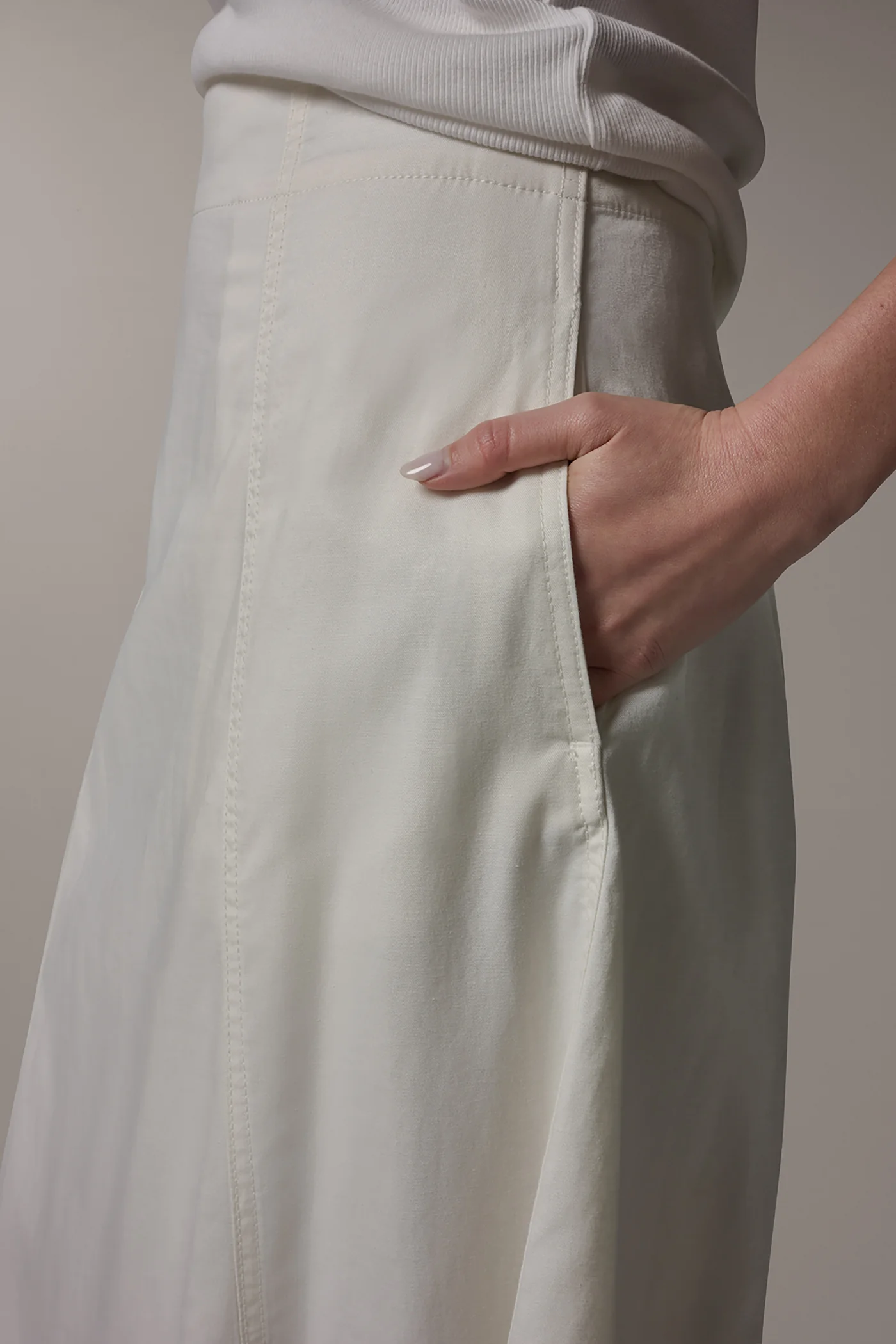 Off-white panelled A-line midi skirt with side pockets and a back zipper