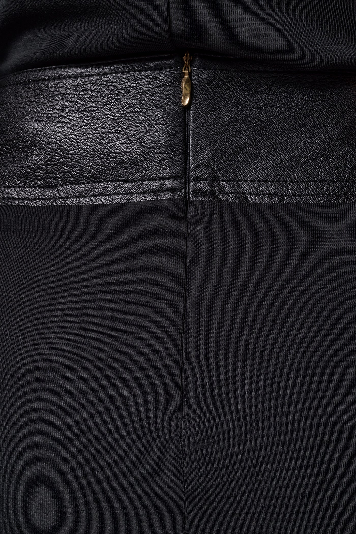 Black draped jersey midi skirt with a crossover leather waistband