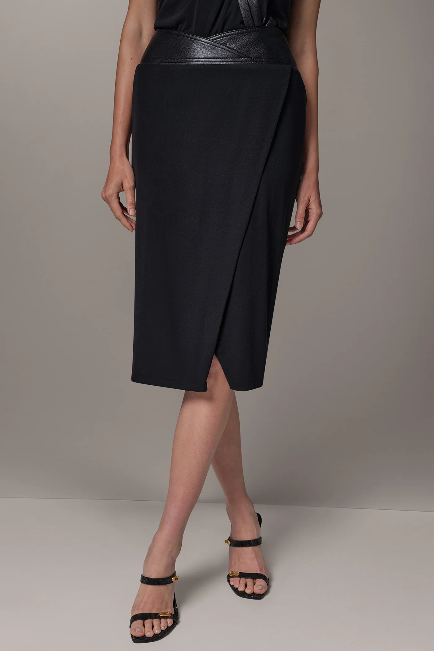Black draped jersey midi skirt with a crossover leather waistband