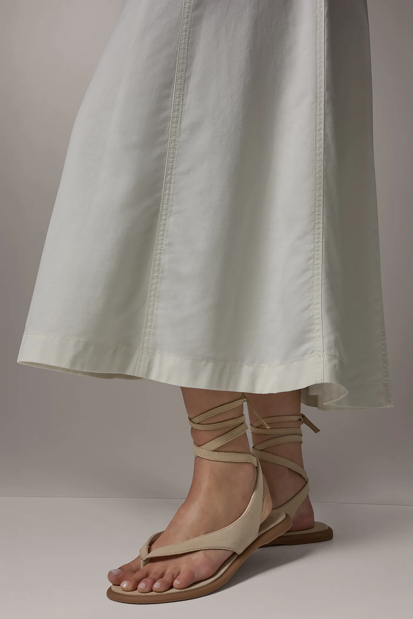 Off-white panelled A-line midi skirt with side pockets and a back zipper